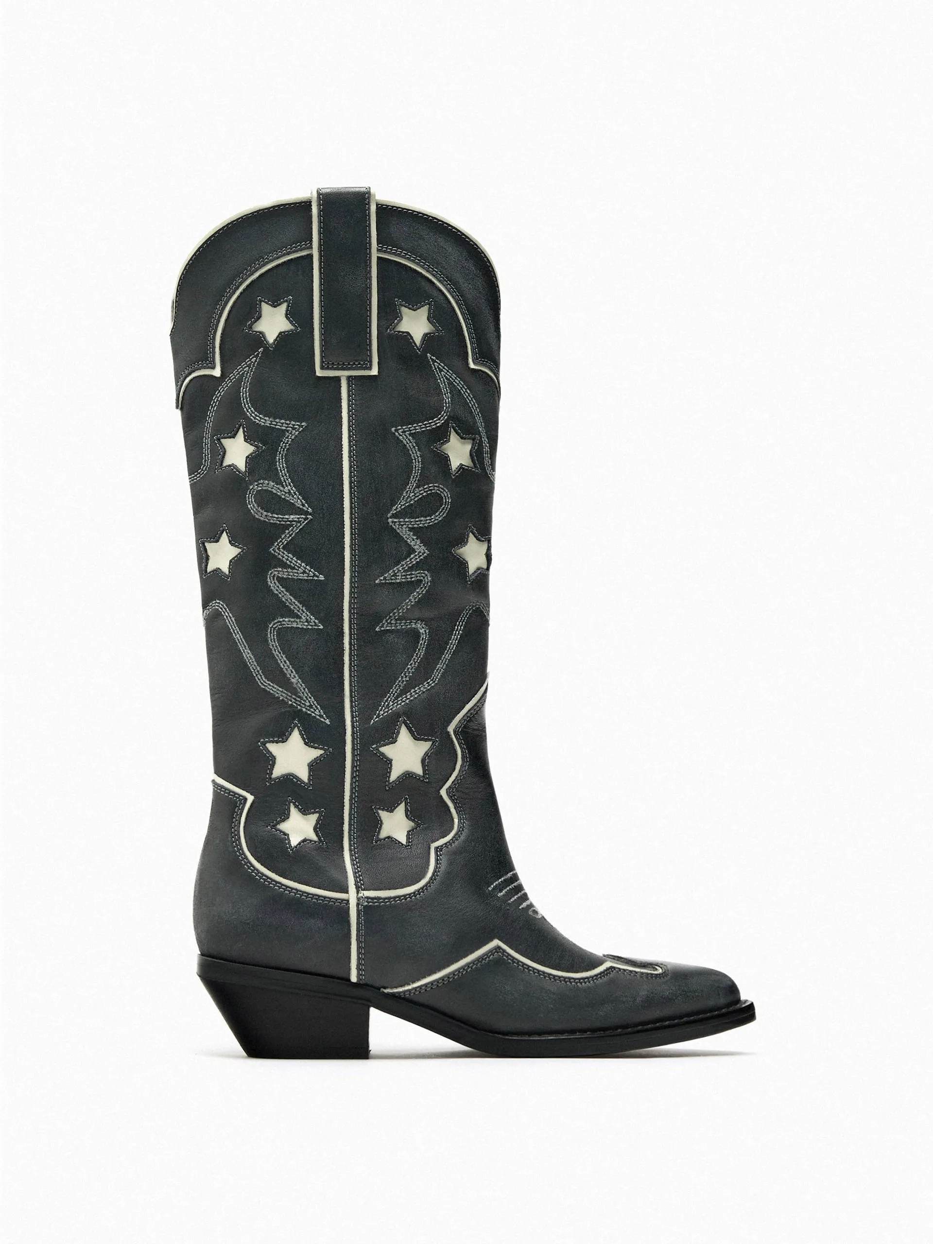 Black leather cowboy boots with stars